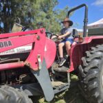 child on farm tractor
